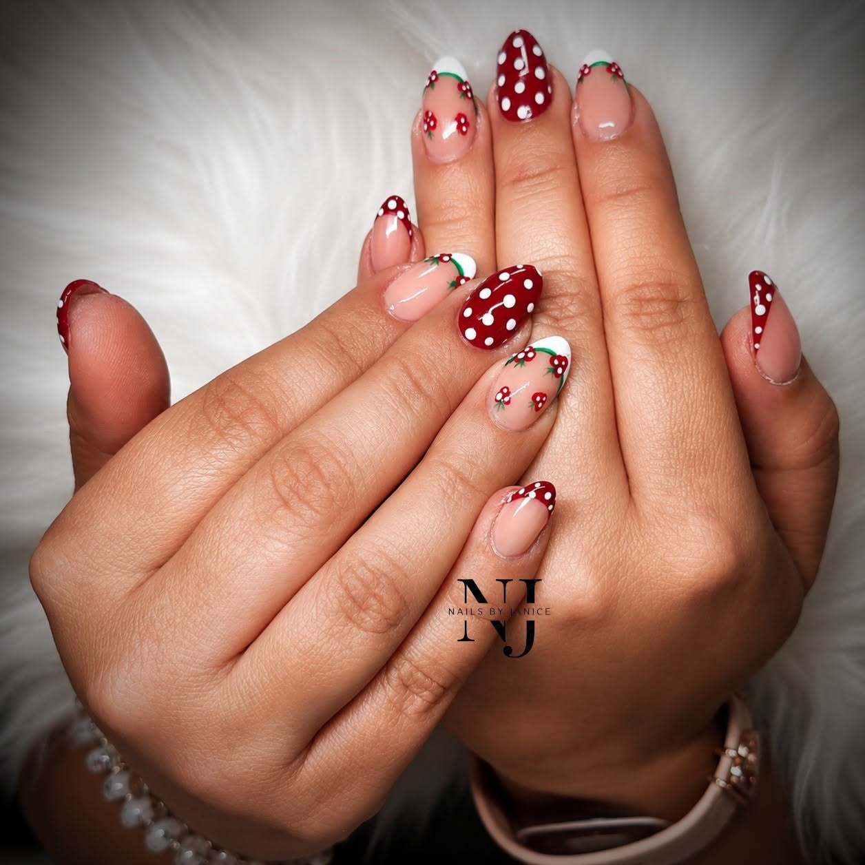 Red polka dot and cherry French tip almond nails